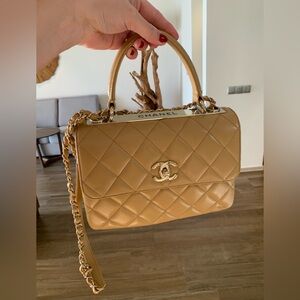 Authentic limited edition , rare nude larger Chanel purse with handle /stripe.